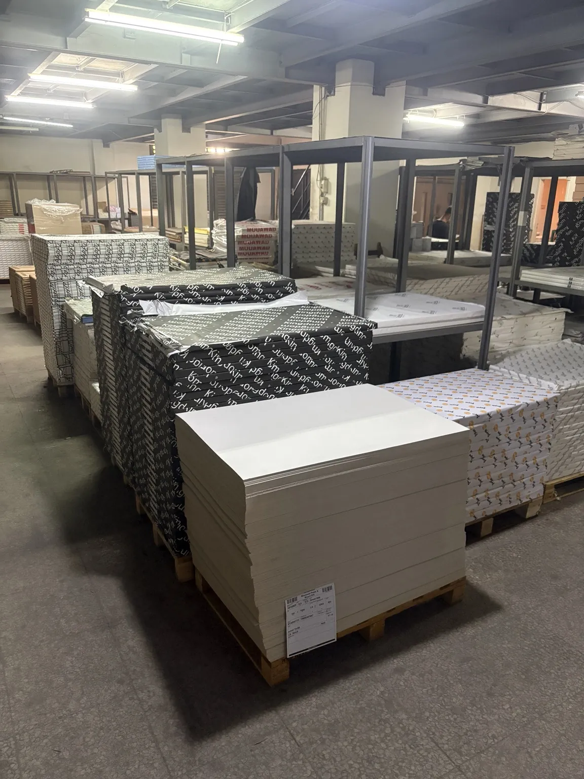 Stacked board and wrapped pallets in the Mouawad warehouse